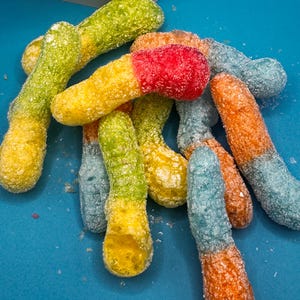 Freeze dried sour gummy worms treat snack candy puff